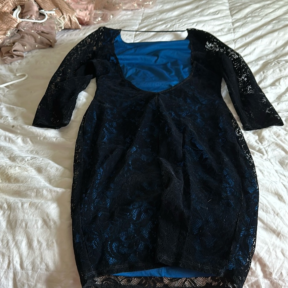 This dress is beautiful and has a low back! Fits good to size